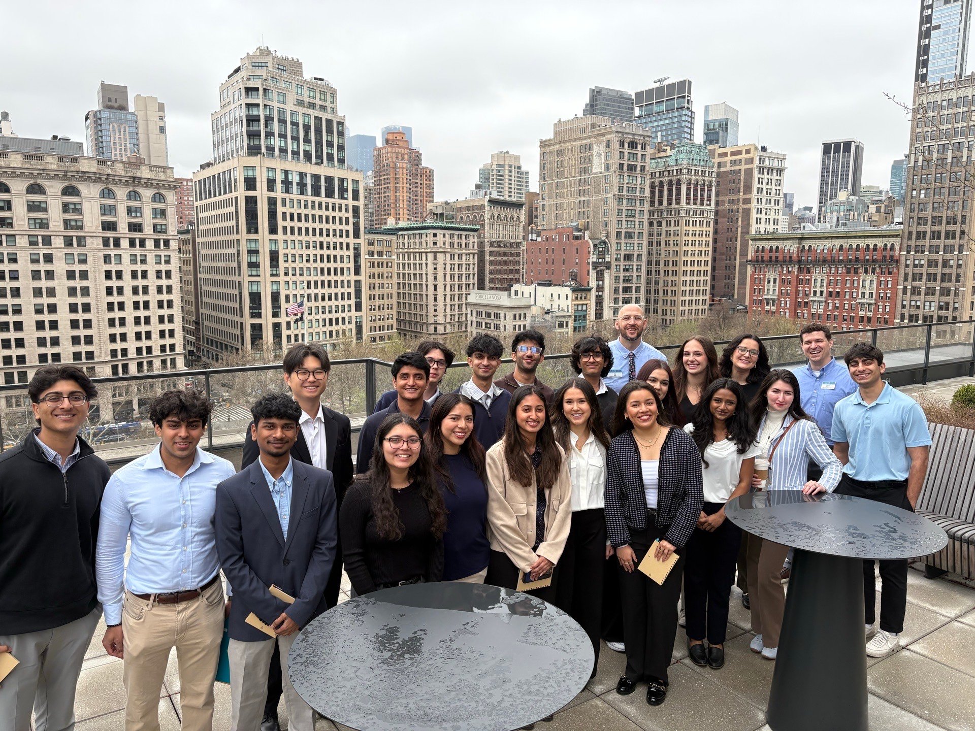 The Tech Trek group on a rooftop terrace with the Manhattan skyline behind them.